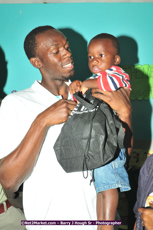 Usain Bolt of Jamaica - The Fastest Man In The World  - Usain Bolt Homecoming Celebrations - Press Conference at the Grand Bahia Principe &amp; Sherwood Content - Waldensia Primary School - Photographs by Net2Market.com - Barry J. Hough Sr. Photojournalist/Photograper - Photographs taken with a Nikon D300 - Negril Travel Guide, Negril Jamaica WI - http://www.negriltravelguide.com - info@negriltravelguide.com...!